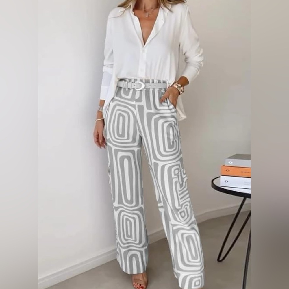 New, in original bag, did not have tags. Small blouse and pants 2 piece outfit